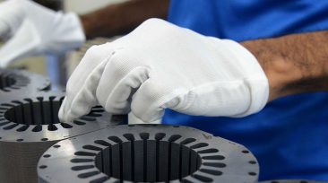 In this photograph taken on December 8, 2016, an Indian technician inspects components on an assembly line of Highly Electrical Appliances India Pvt. Ltd. at a company air-conditioner compressor plant at Matoda, some 20 kms. from Ahmedabad. / AFP / SAM PANTHAKY (Photo credit should read SAM PANTHAKY/AFP/Getty Images)